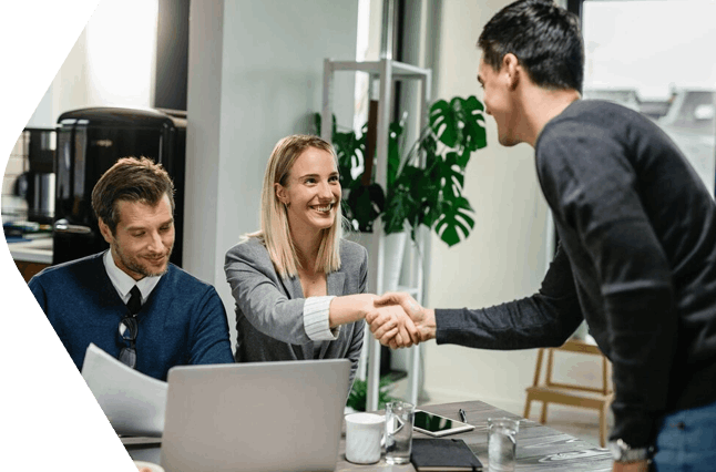 Business handshake in office
